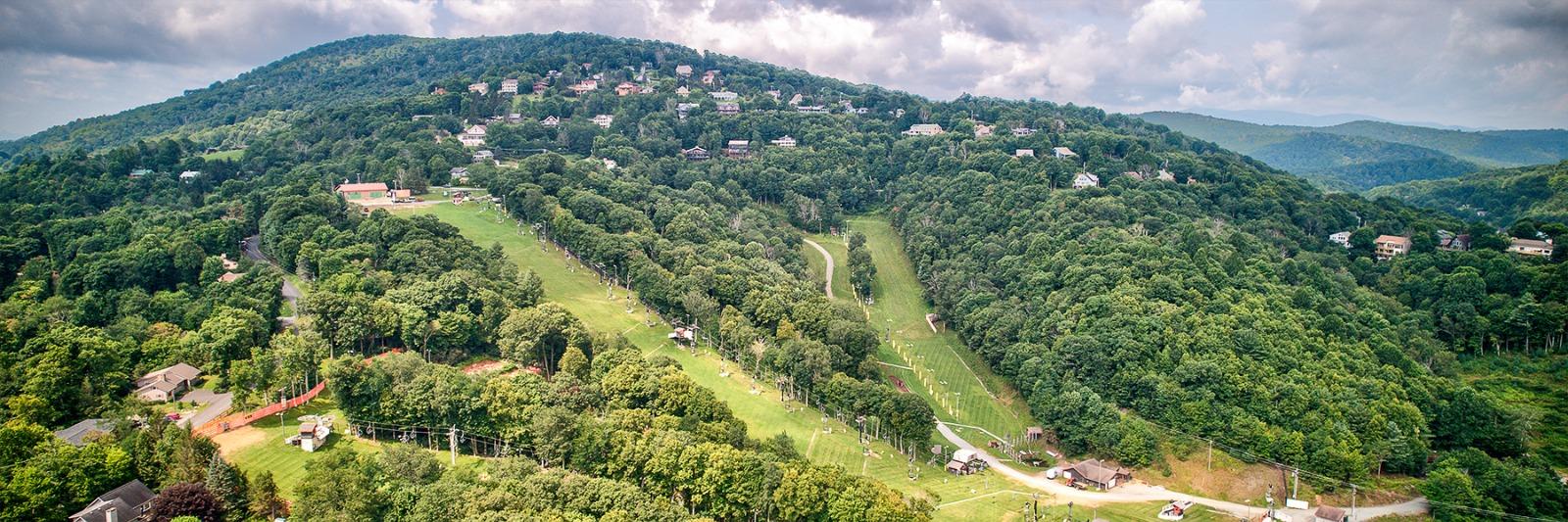 Appalachian Ski Mountain cabins surrounded by colorful mountain forest